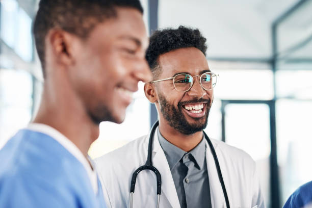 A doctor and a nurse smiling